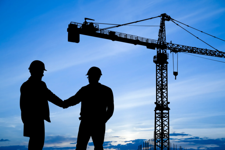 Handshake against a blue sky, symbolizing partnership and trust